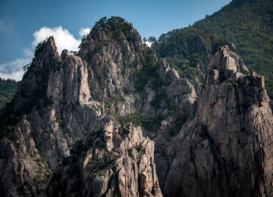Stunning view of the craggy peaks in Seoraksan National Park, Korea, showcasing rocky textures and lush greenery.