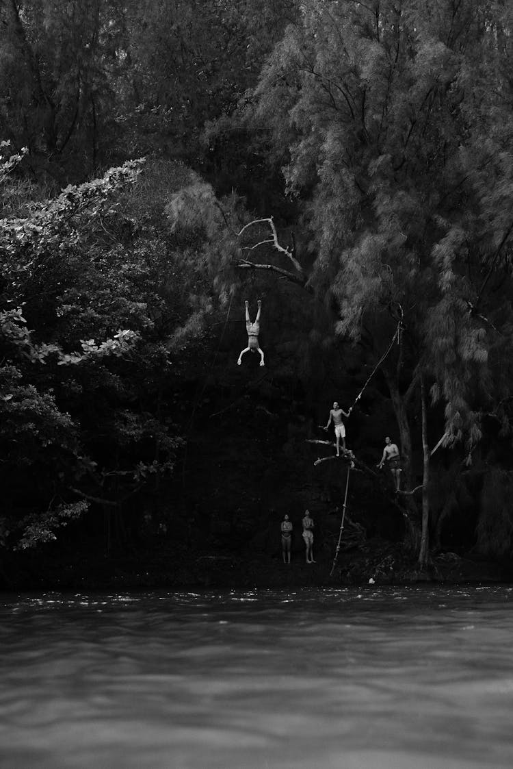 People Jumping To River