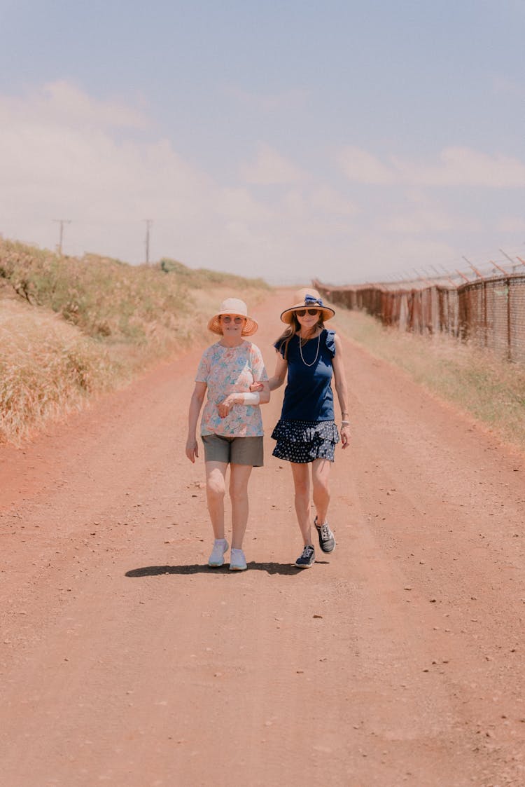 Girls Walking Together On Road