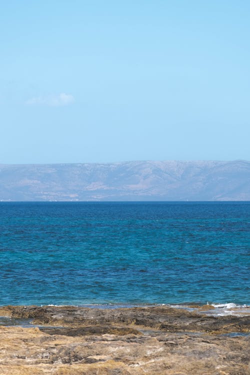 Landscape of a Shore and Mountains in Distance 