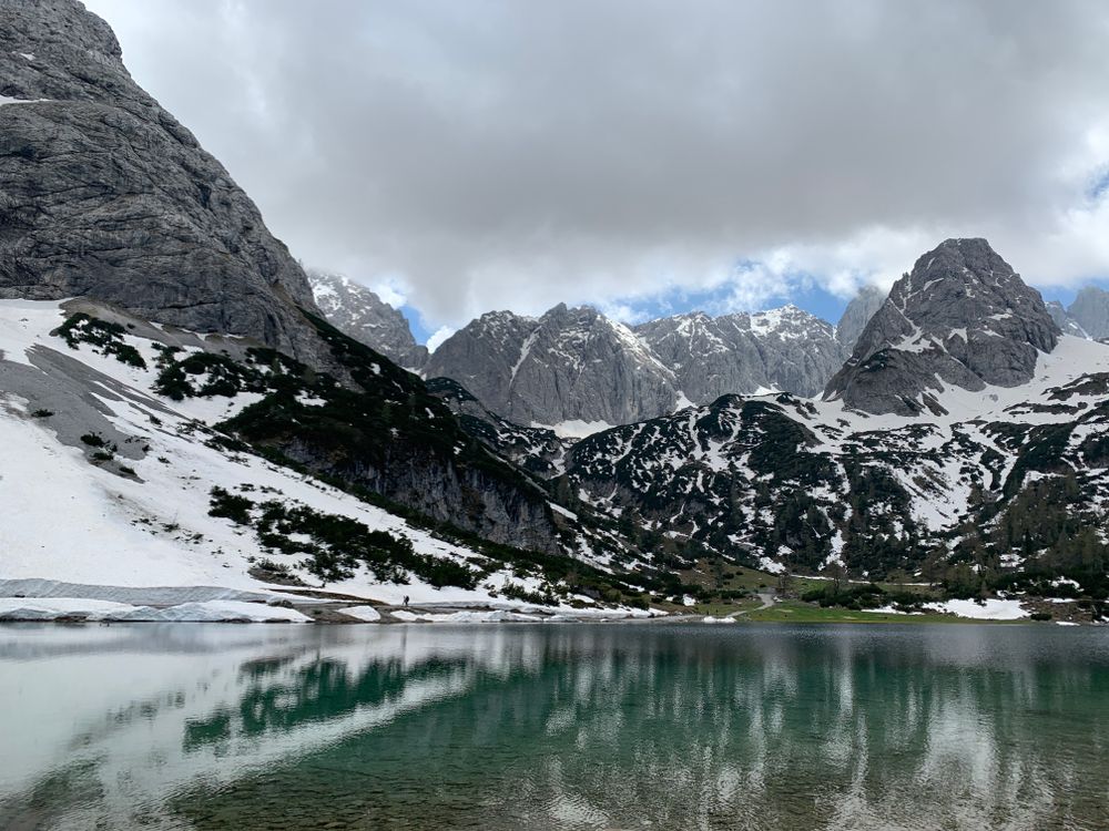 Cold Alpine Lake in Cold Snowy Mountains · Free Stock Photo