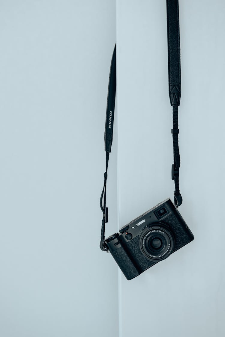 Camera Hanging On White Wall