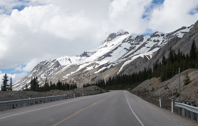 Mountains In Snow Seen From Road