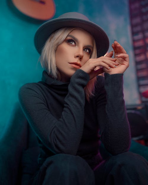 Free Woman in Black Long Sleeve Shirt and Black Hat Stock Photo