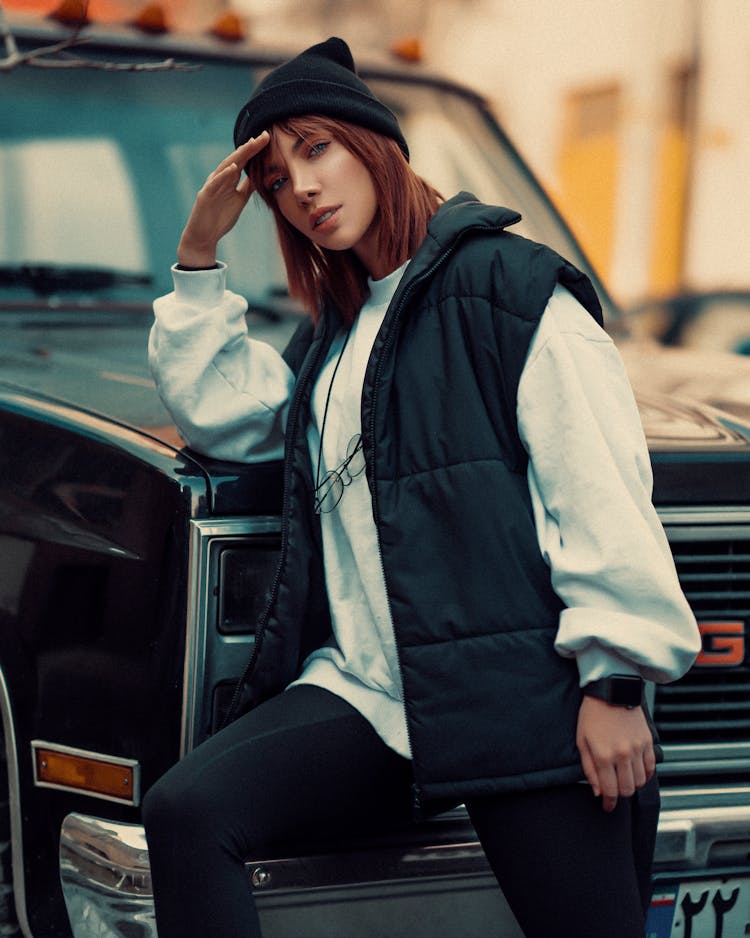 Woman Wearing Black Beanie Standing Near Black Van