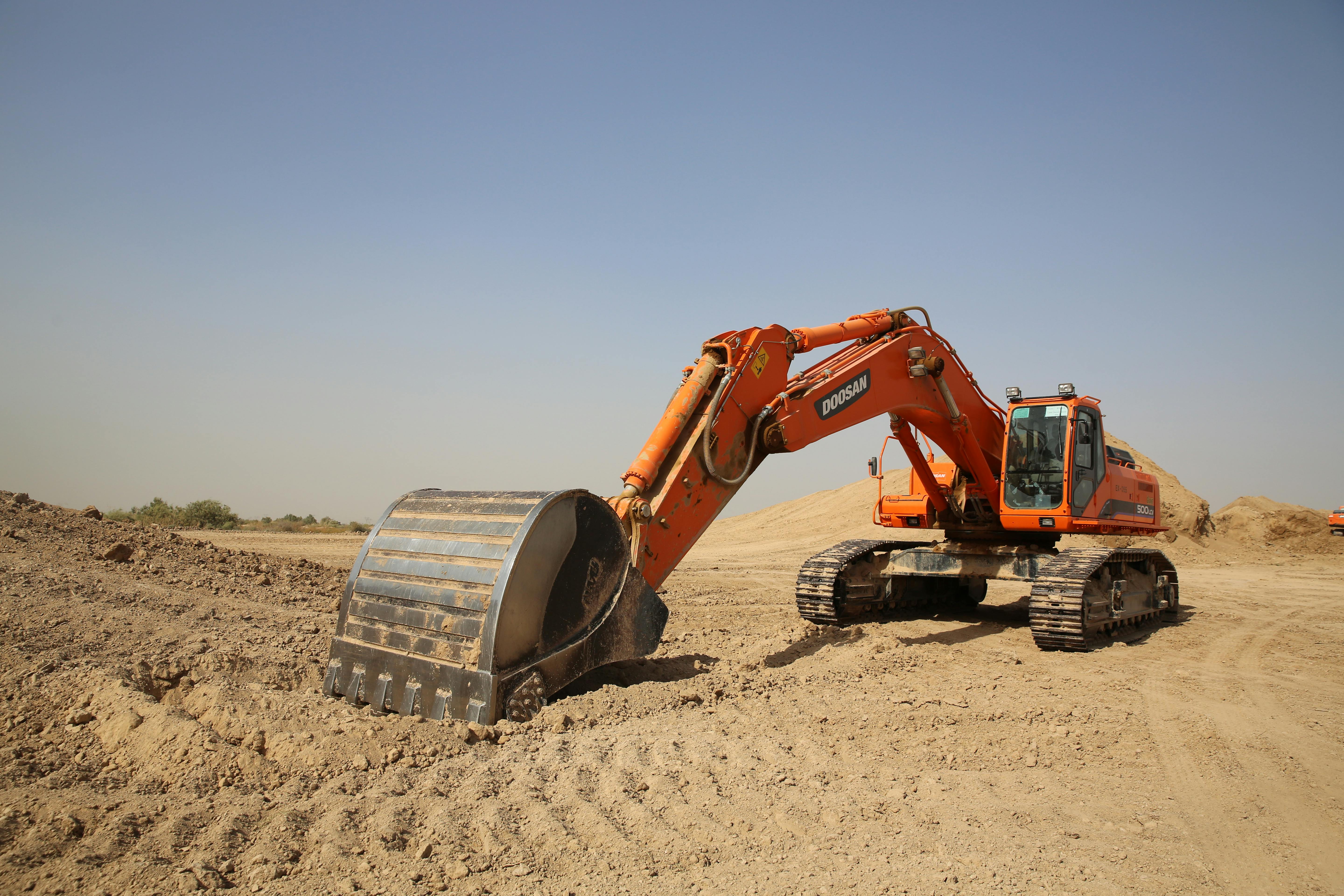 Photo of Orange Excavator · Free Stock Photo