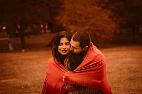 A Couple Draped in Red Scarf 