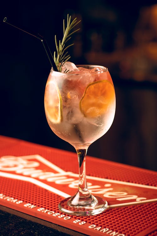 Cocktail Glass with Ice Cubes and Lemon Slices