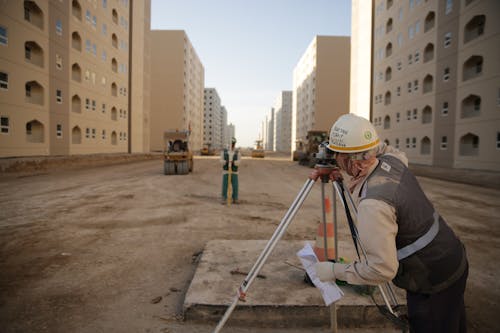 Person Looking through a Theodolite