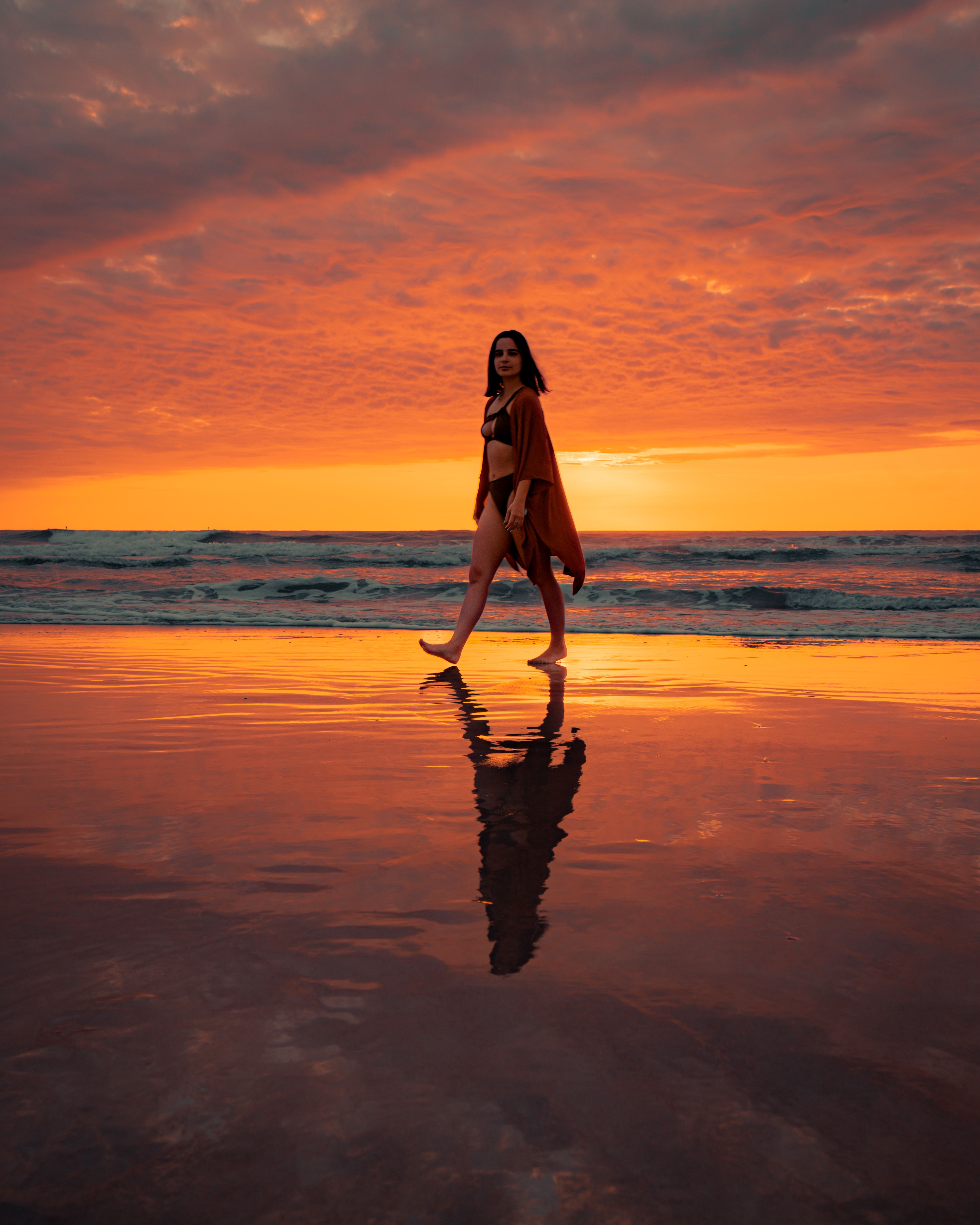 Woman in Black Bikini Walking on Beach during Sunset · Free Stock Photo