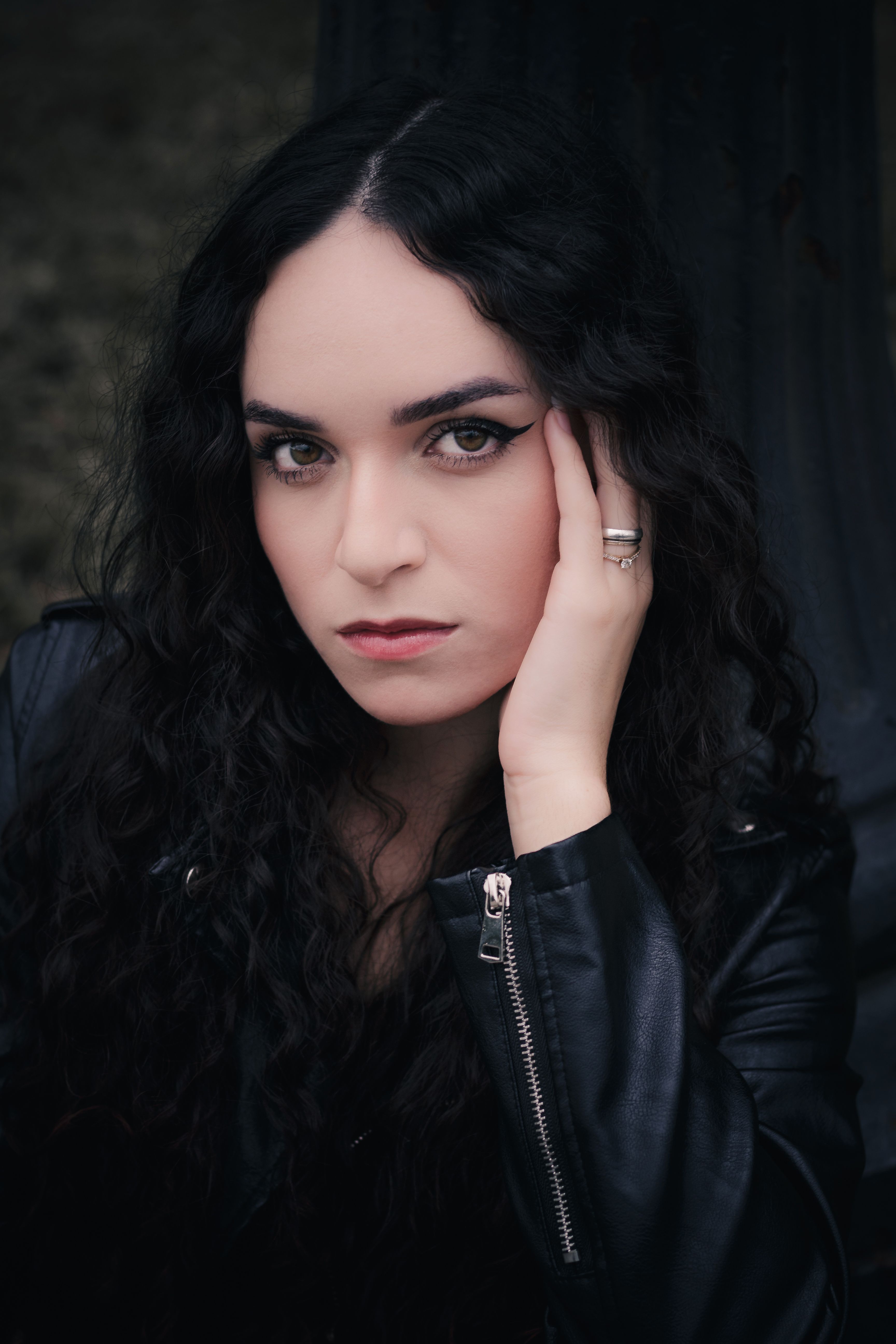 A Portrait of a Woman Wearing a Leather Jacket · Free Stock Photo