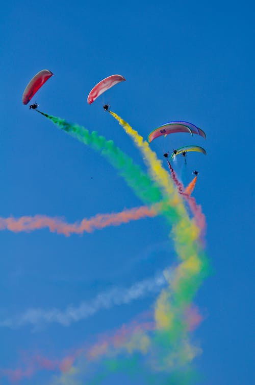 Free Skydivers with Colourful Smoke Stock Photo