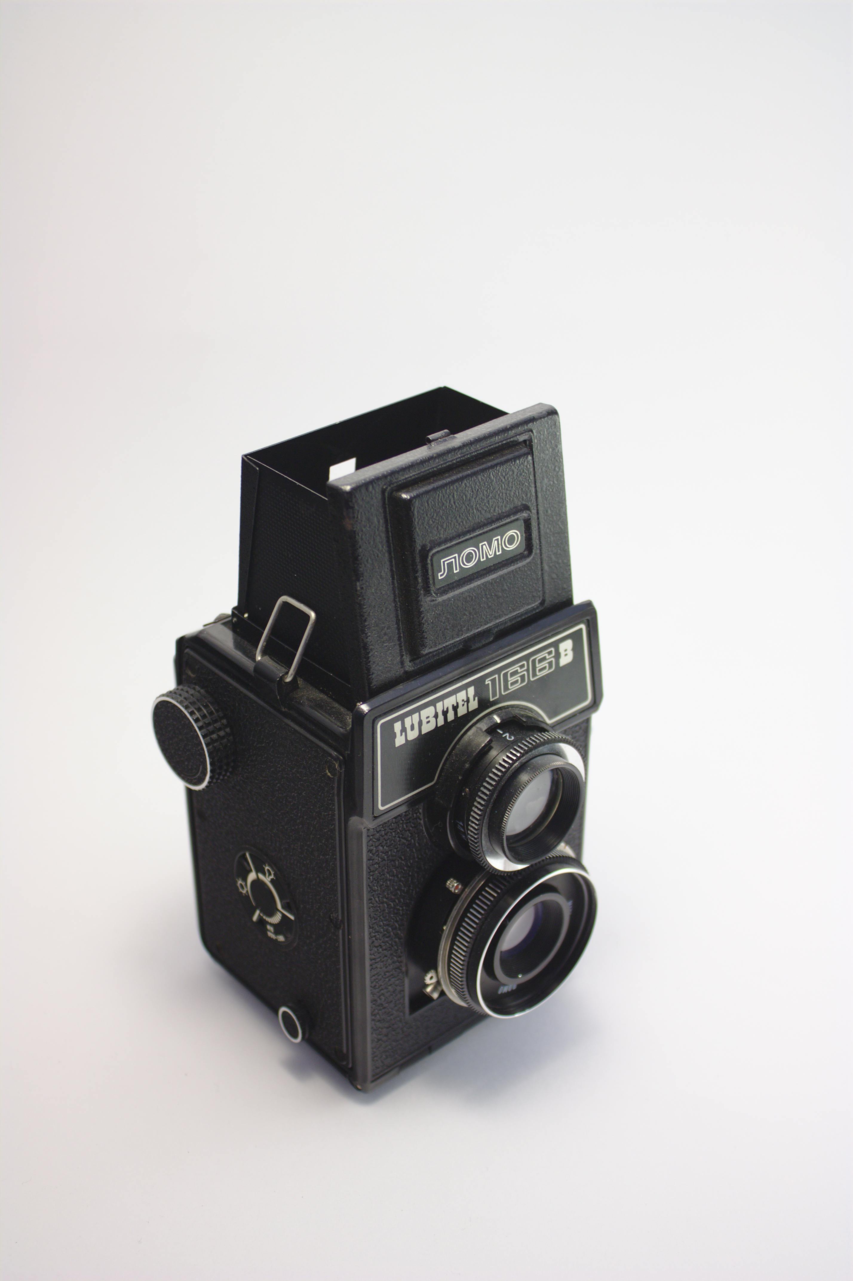 Classic Lomo Lubitel 166B twin-lens reflex camera on a neutral background.