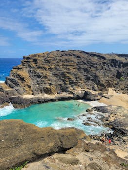 A breathtaking view of Halona Beach Cove with its turquoise waters and rugged cliffs in Hawaii.