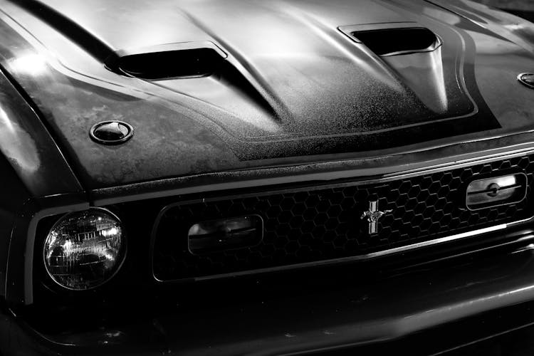 A Grayscale Of A Ford Mustang Mach 1