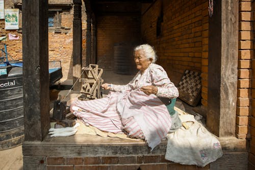 An Elderly Woman Working