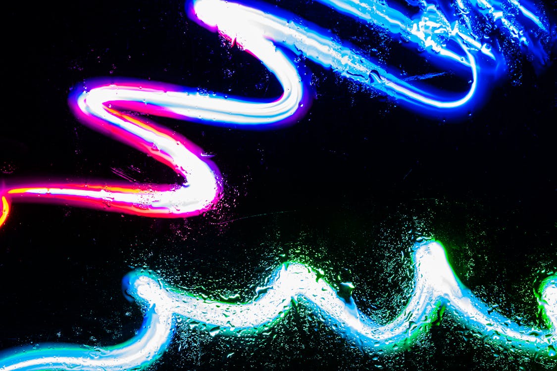 Colorful Neon Lights on Black Background · Free Stock Photo