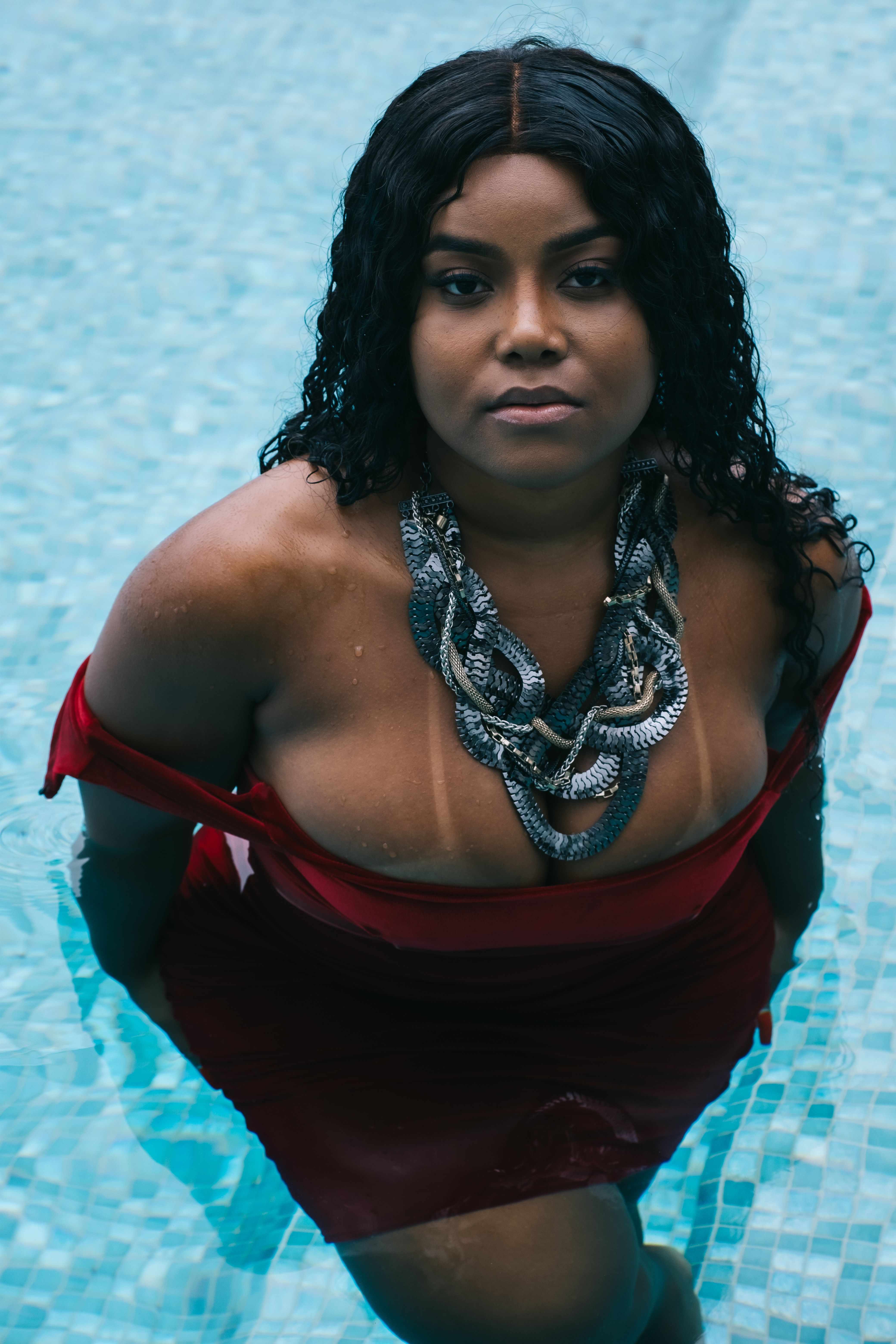 Curvy Woman Wearing a Red Dress  Free Stock Photo