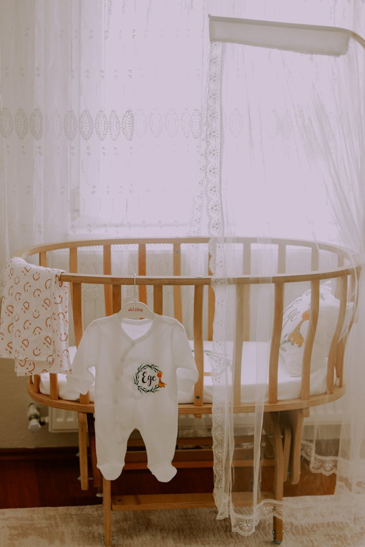 Baby Crib With Baby Clothing