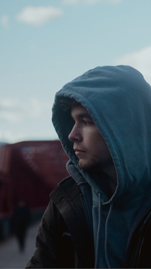 A Man Wearing a Blue Hoodie Sweater