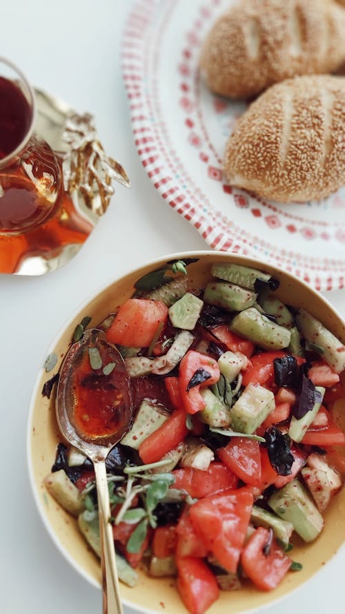 A Bowl with Slices of Tomatoes and Cucumbers