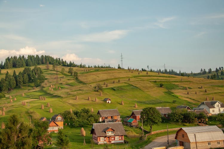 View Of Village At Feet Of Hills