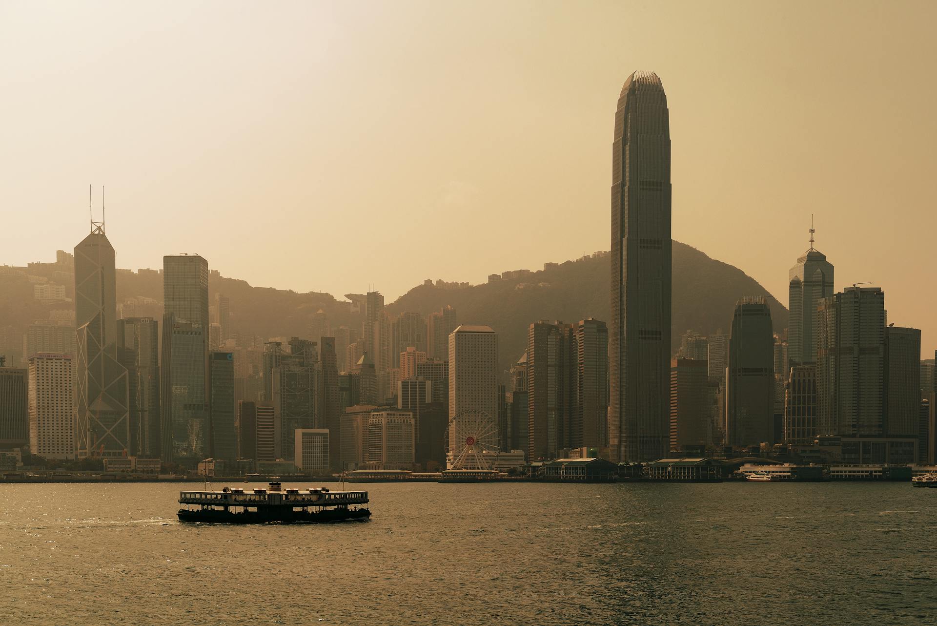 A breathtaking view of the Hong Kong skyline with iconic skyscrapers silhouetted at dusk.