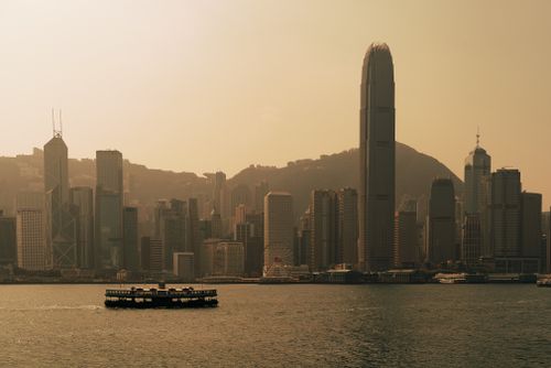 Free A breathtaking view of the Hong Kong skyline with iconic skyscrapers silhouetted at dusk. Stock Photo
