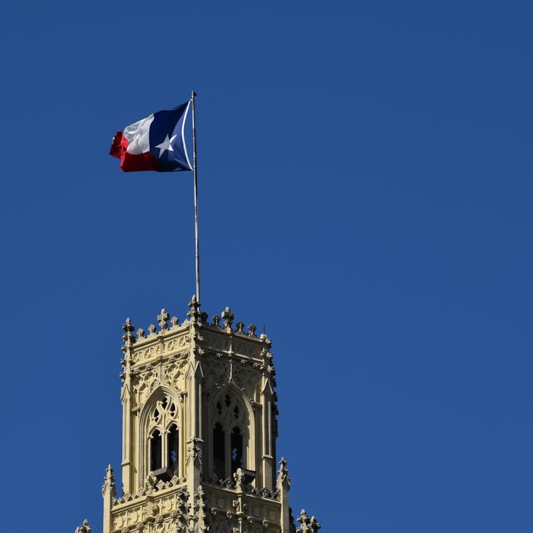 The Texas Flag On Top Of The Emily Morgan Hotel Tower