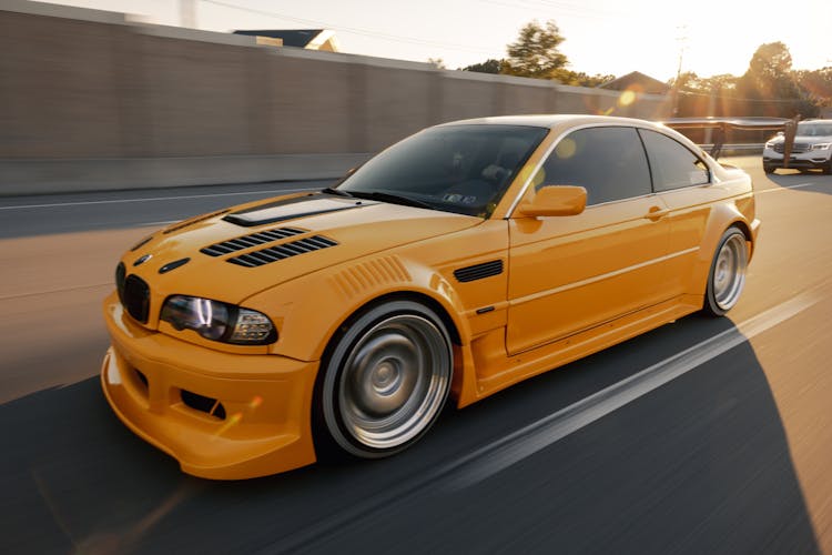 A Yellow BMW E46 On The Road