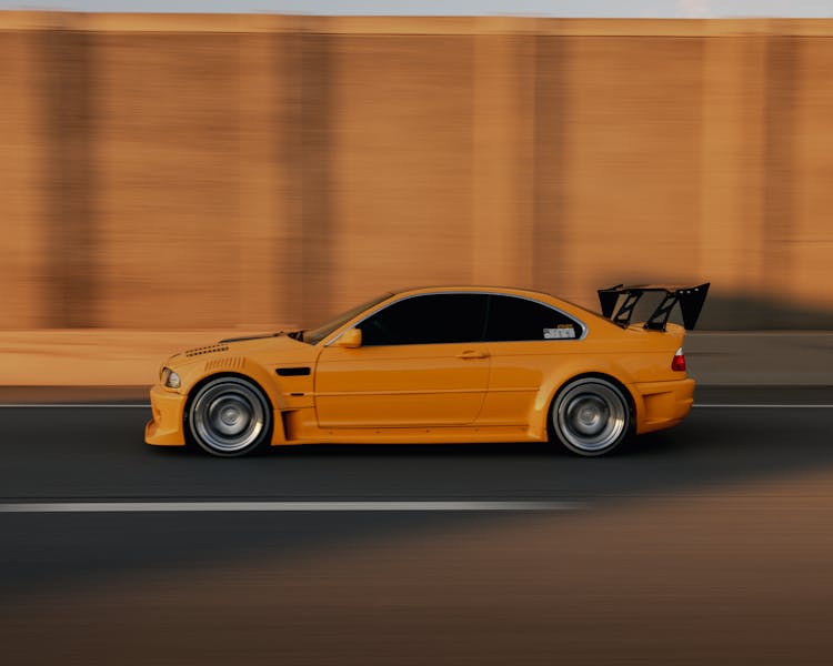 A Yellow BMW E46 M3 On The Road