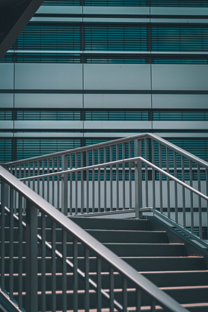 Steel staircase with welded handrails