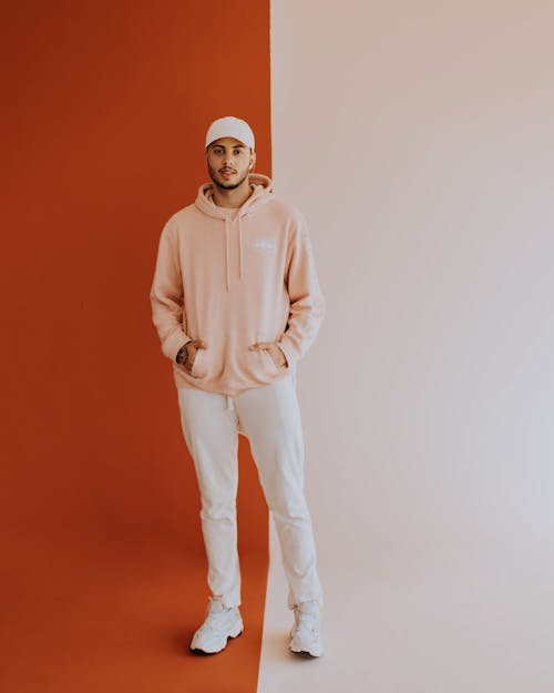 Man in Hoodie on Red and White Background