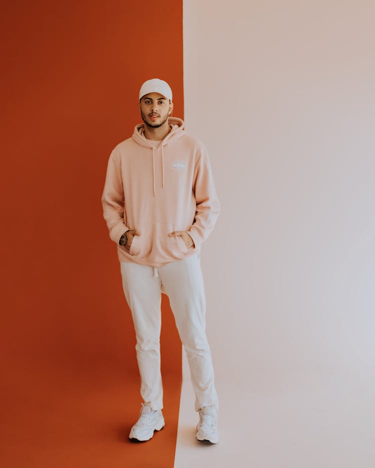 Man In Hoodie On Red And White Background