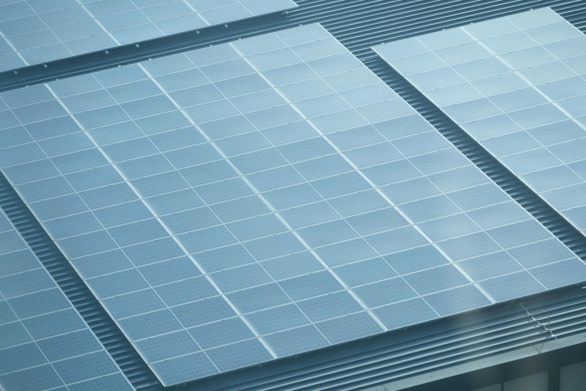 Detailed view of solar panels installed on a rooftop, showcasing green energy.