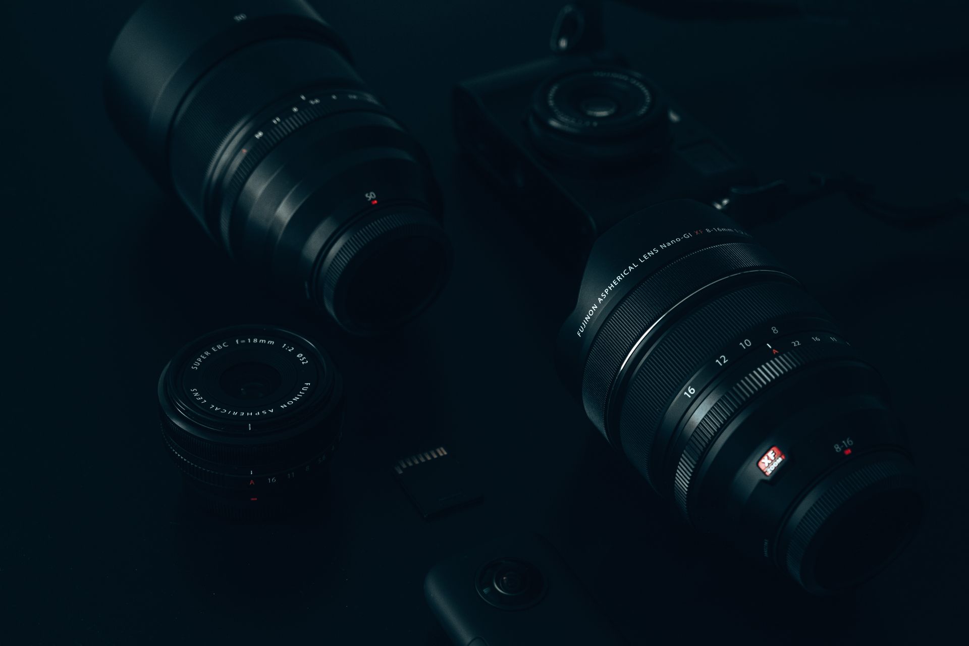 Variety of Camera Lenses on Black Surface
