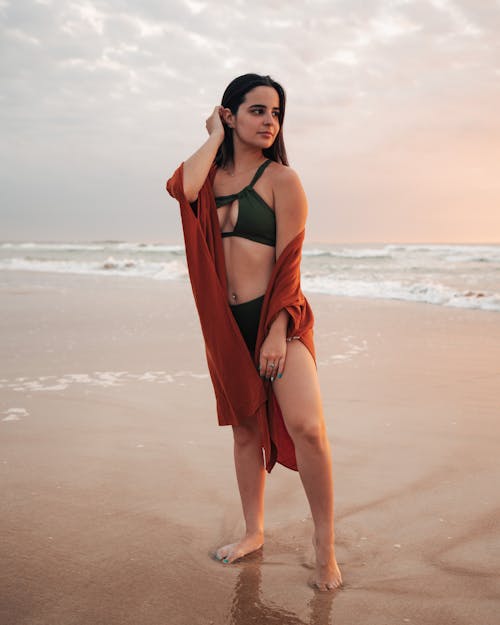 Free Woman in Bikini Standing on Beach Sand Stock Photo