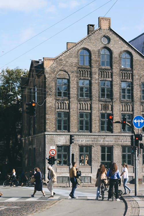 Photo of People Crossing a Road