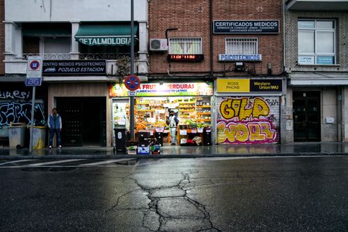 Free Vibrant urban scene with graffiti and fruit store in Pozuelo de Alarcón. Stock Photo
