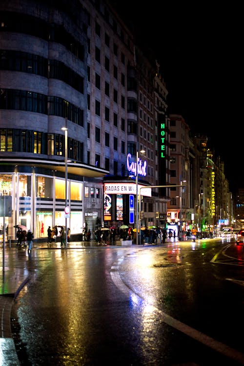 People on Sidewalk at Night