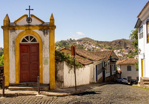 Free Charming street view in Ouro Preto, Brazil showcasing colonial architecture and cobblestone path. Stock Photo