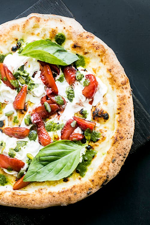 Free Baked Pizza with Basil Leaves Stock Photo