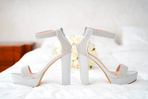 Close-up Photo of White High Heels