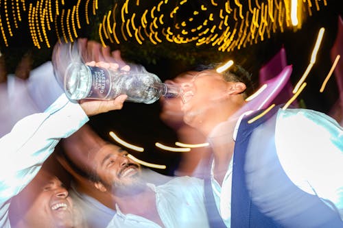 Free People Having Fun and Drinking at a Party  Stock Photo