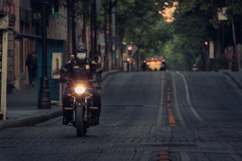 A Police Officer Riding a Motorcycle