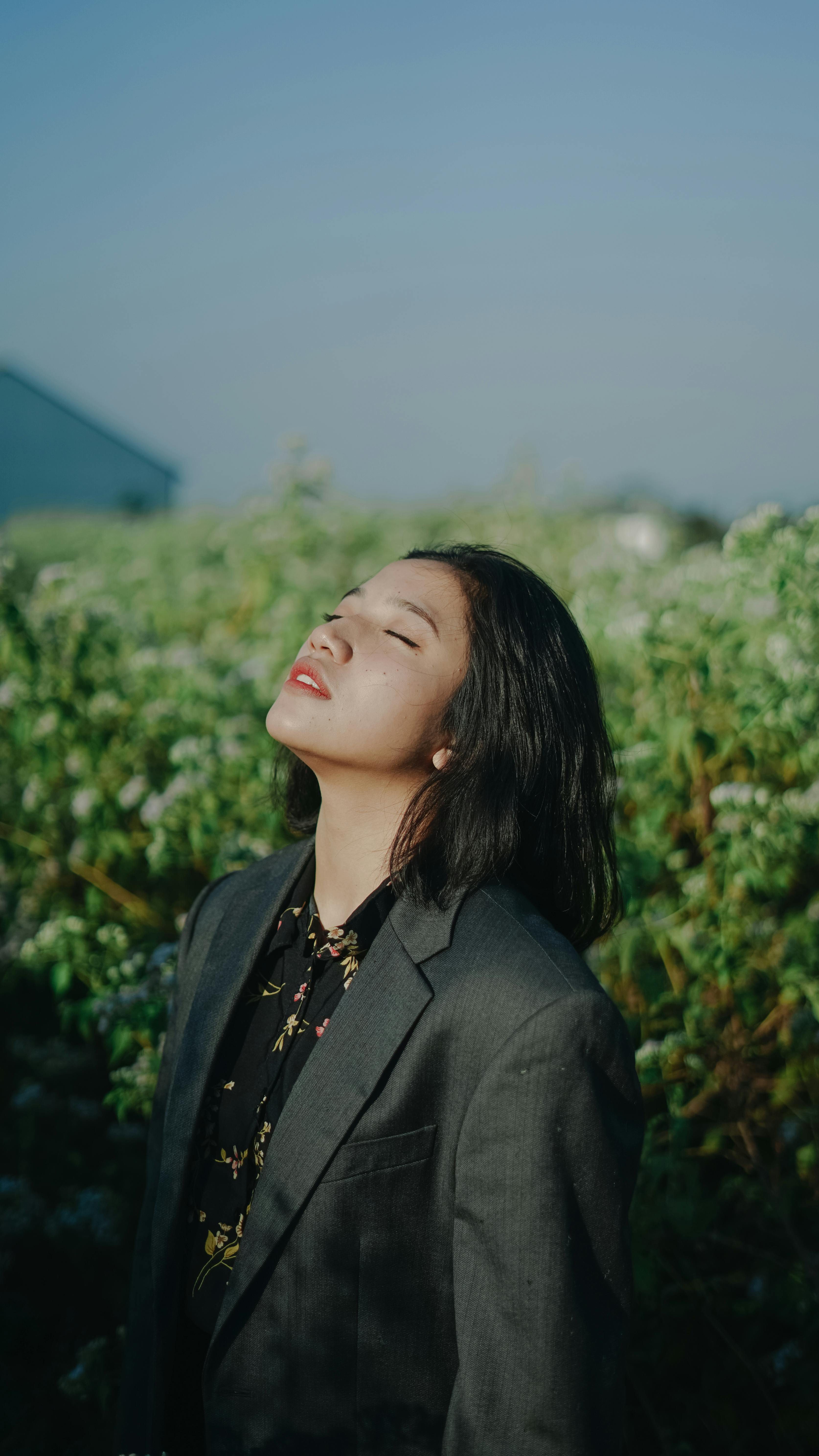 Portrait of a woman in a suit enjoying the outdoors in Indonesia.