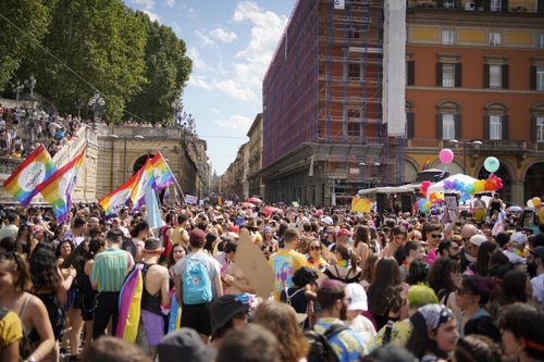 Free A lively and colorful pride parade fills the streets of Bologna, Italy, with crowds celebrating diversity and inclusion. Stock Photo