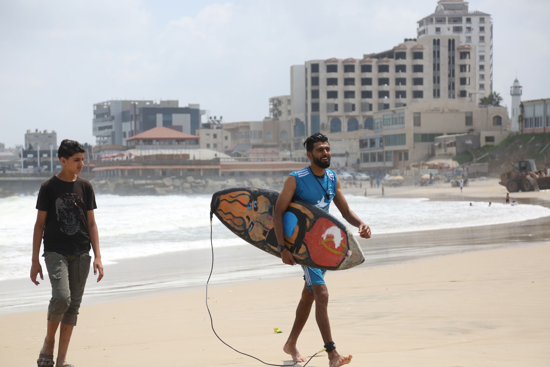 Gaza surfers ride waves of defiance as war tries to drown them