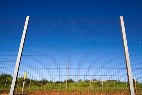 Mesh Wire Fence Under Blue Sky