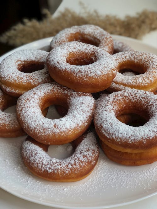 Close-Up Photo of Donuts with Powdered Sugar